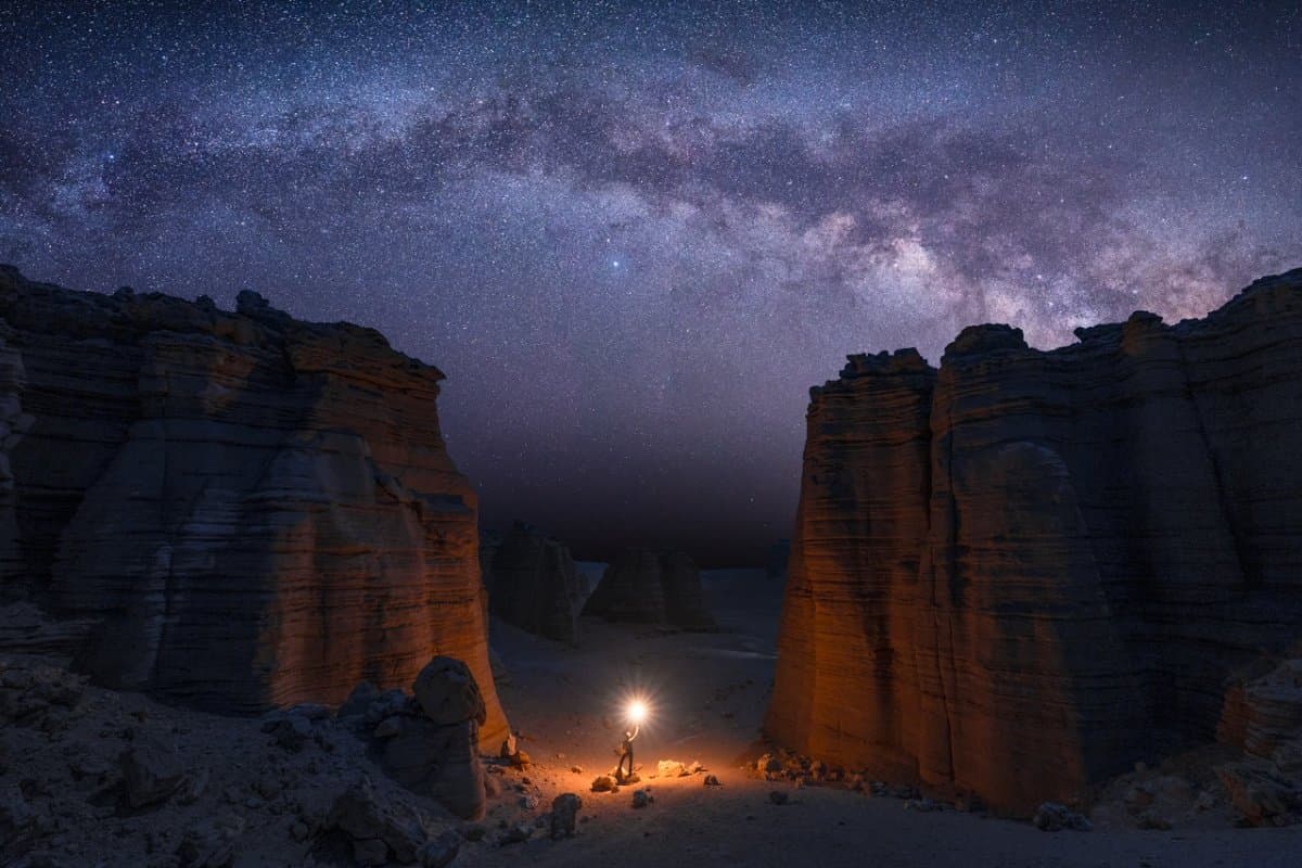 Desert hotel at Dahaidao Red Willow Beach with yardangs and starry sky