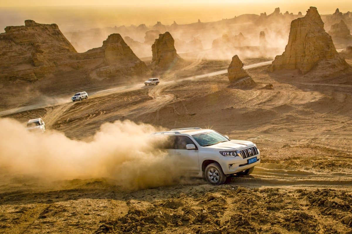 4WD vehicles driving through Dahaidao yardang formations