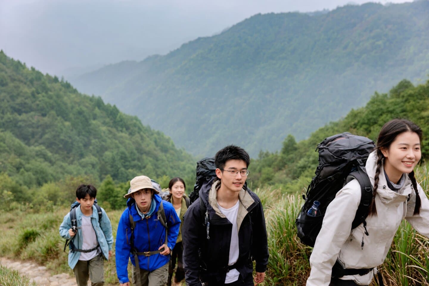Group of hikers on a mountain trail in Sichuan